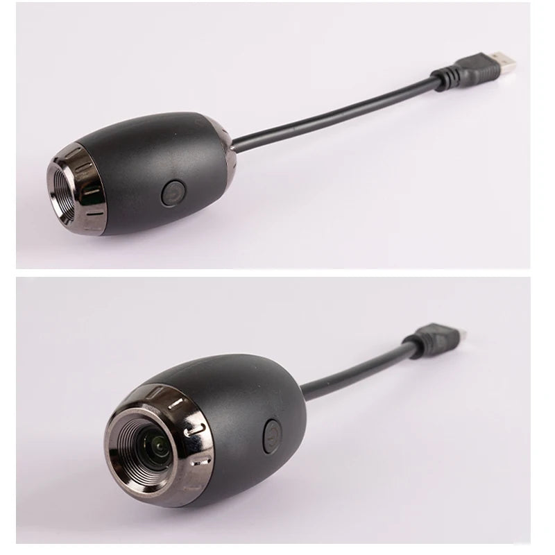 Black and silver electronic device with a cable on a white background