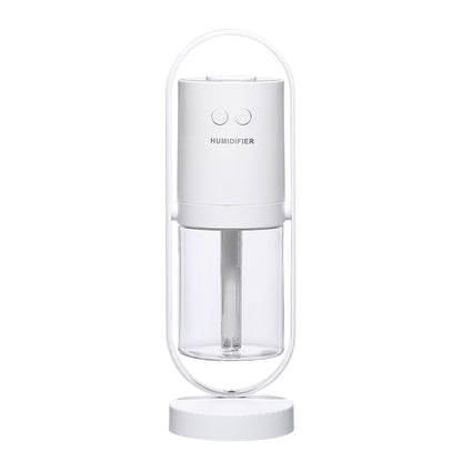 Portable white smart home aromatherapy diffuser displaying dual function keys and integrated handle.
