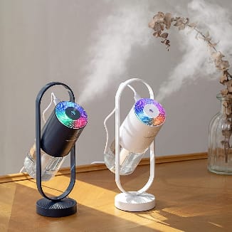 Essential oil diffuser with 7-color mood light on bedroom nightstand