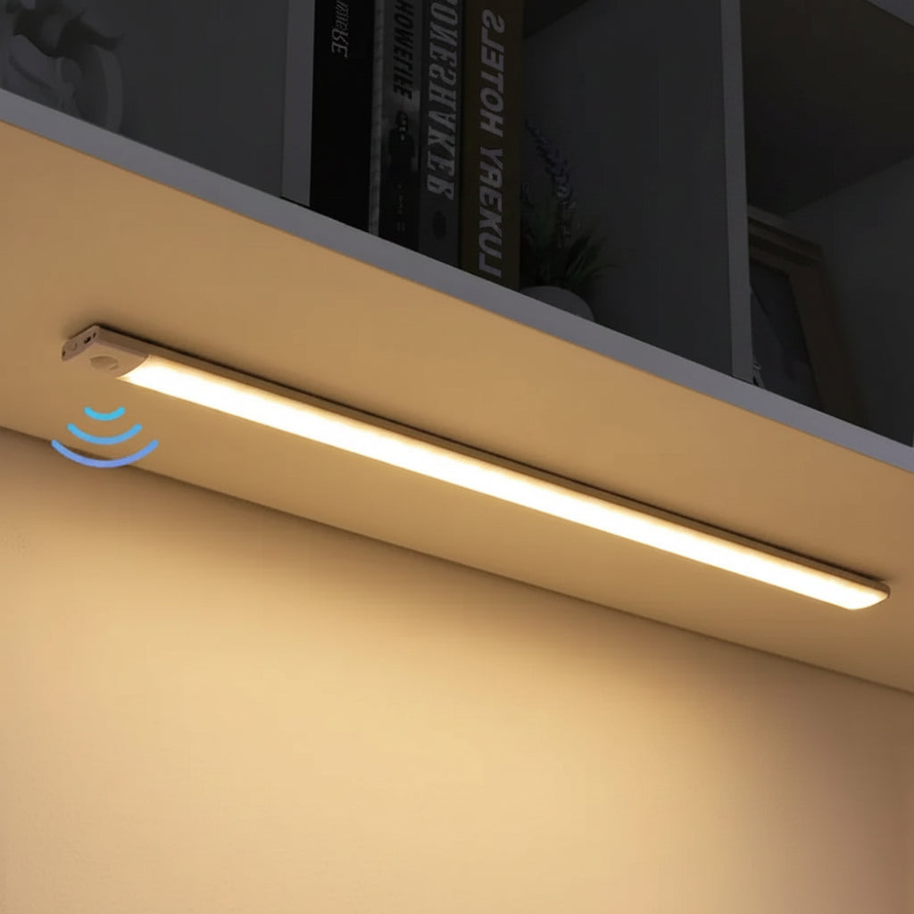 Motion sensor LED cabinet light bar installed under kitchen counter with warm white illumination