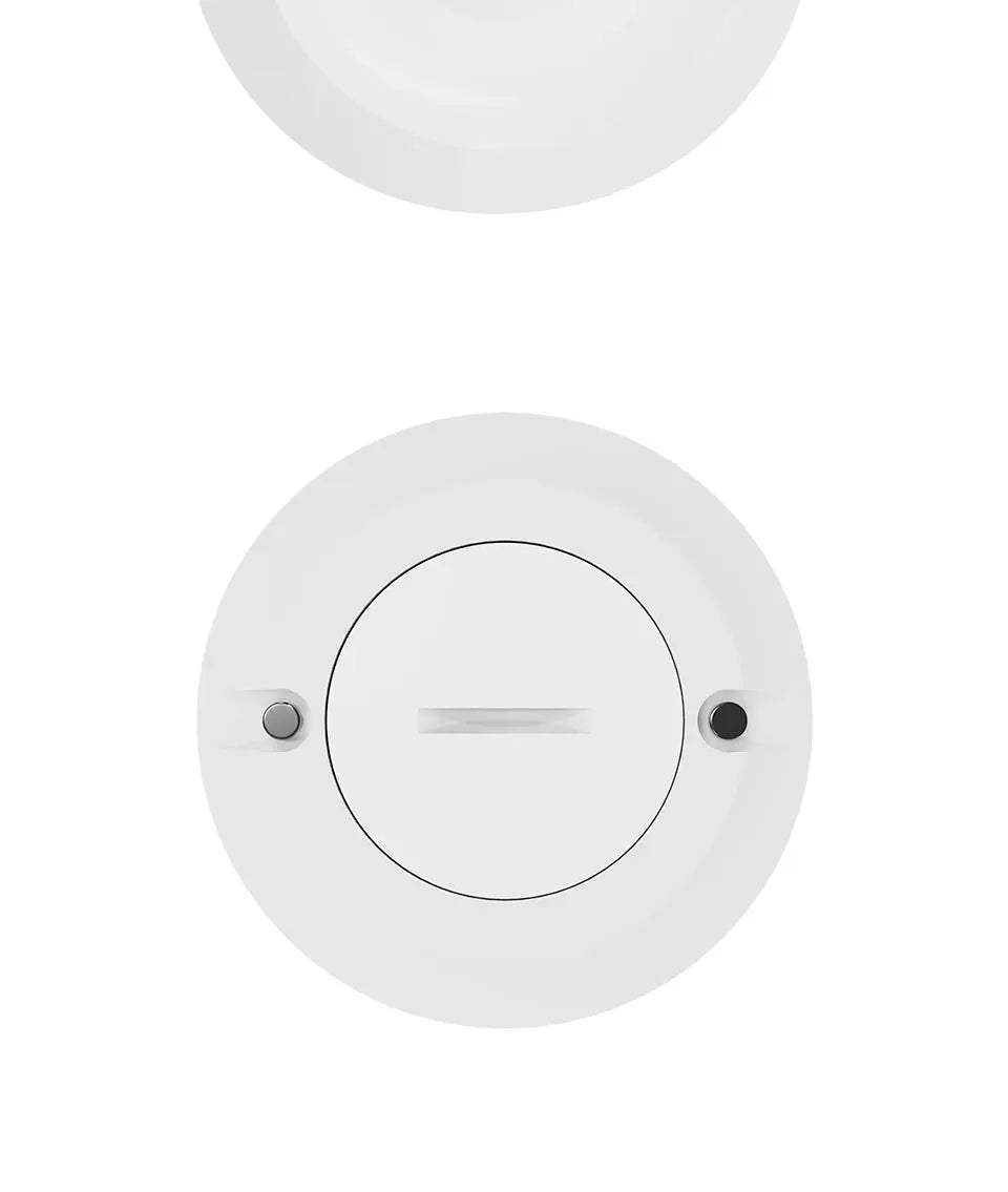 Round white light fixture on a white background
