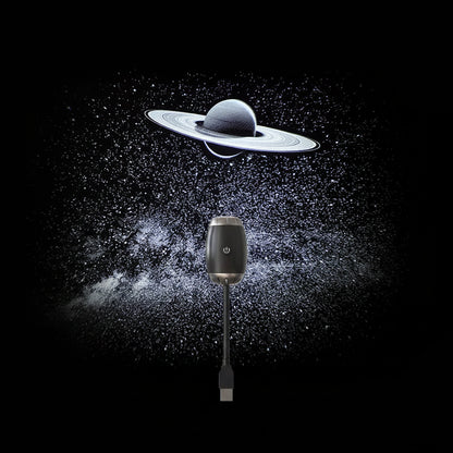 Saturn galaxy projector lamp creating starry sky ceiling in dark bedroom