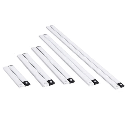 Set of five white LED light strips on a white background