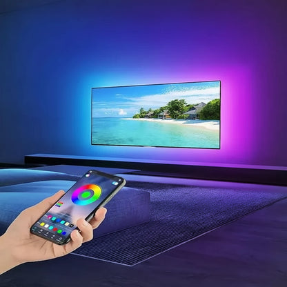 Smart TV with a hand holding a smartphone displaying smart app control features.