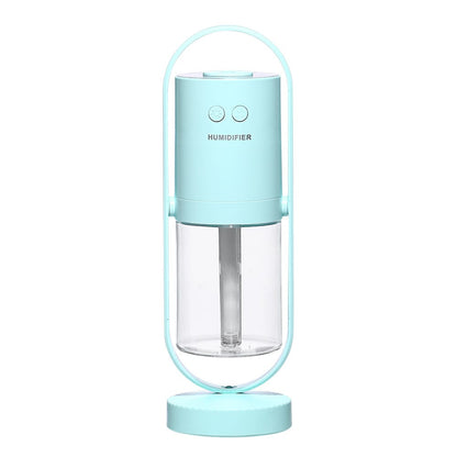Mint green smart home aroma diffuser and mist humidifier device isolated on a white background.