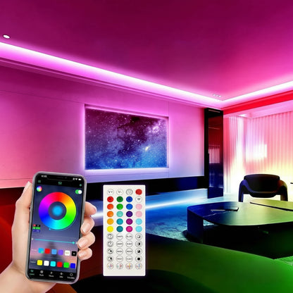 Smartphone with app control and remote control in front of a room with colorful LED strip lights.