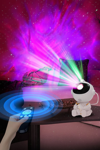 Star projector with remote control on a table, emitting colorful lights against a dark background.