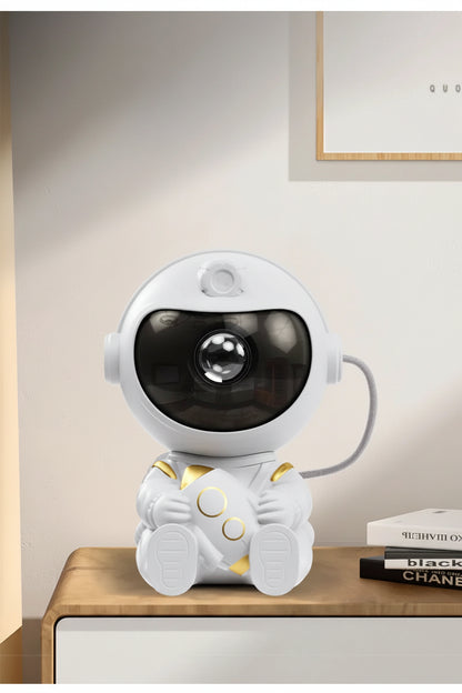 White astronaut design desk ornament on a wooden surface with a neutral background