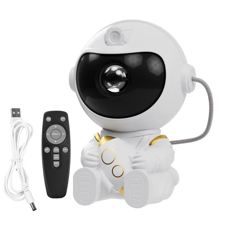 White robot toy with black face and gold accents, accompanied by a remote control and USB cable on a white background.