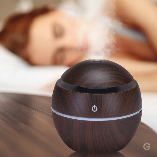 USB desk humidifier with RGB light and ultrasonic cool mist on office desk